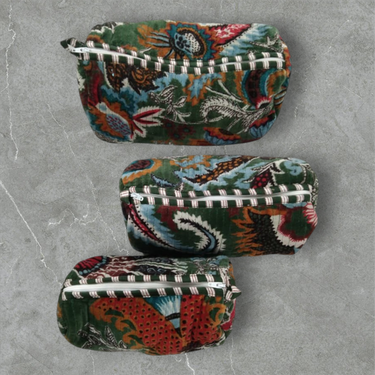 The Teal Thread set of 3 quilted cotton velvet vanity bags in wildflower green with floral print and white zippers.