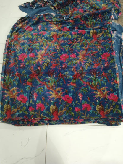The Teal Thread royal blue cotton velvet fabric featuring a vibrant floral and bird paradise print for upholstery.