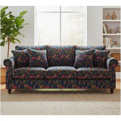 The Teal Thread Paradise Print royal blue cotton velvet fabric upholstered on a three-seater sofa with floral design